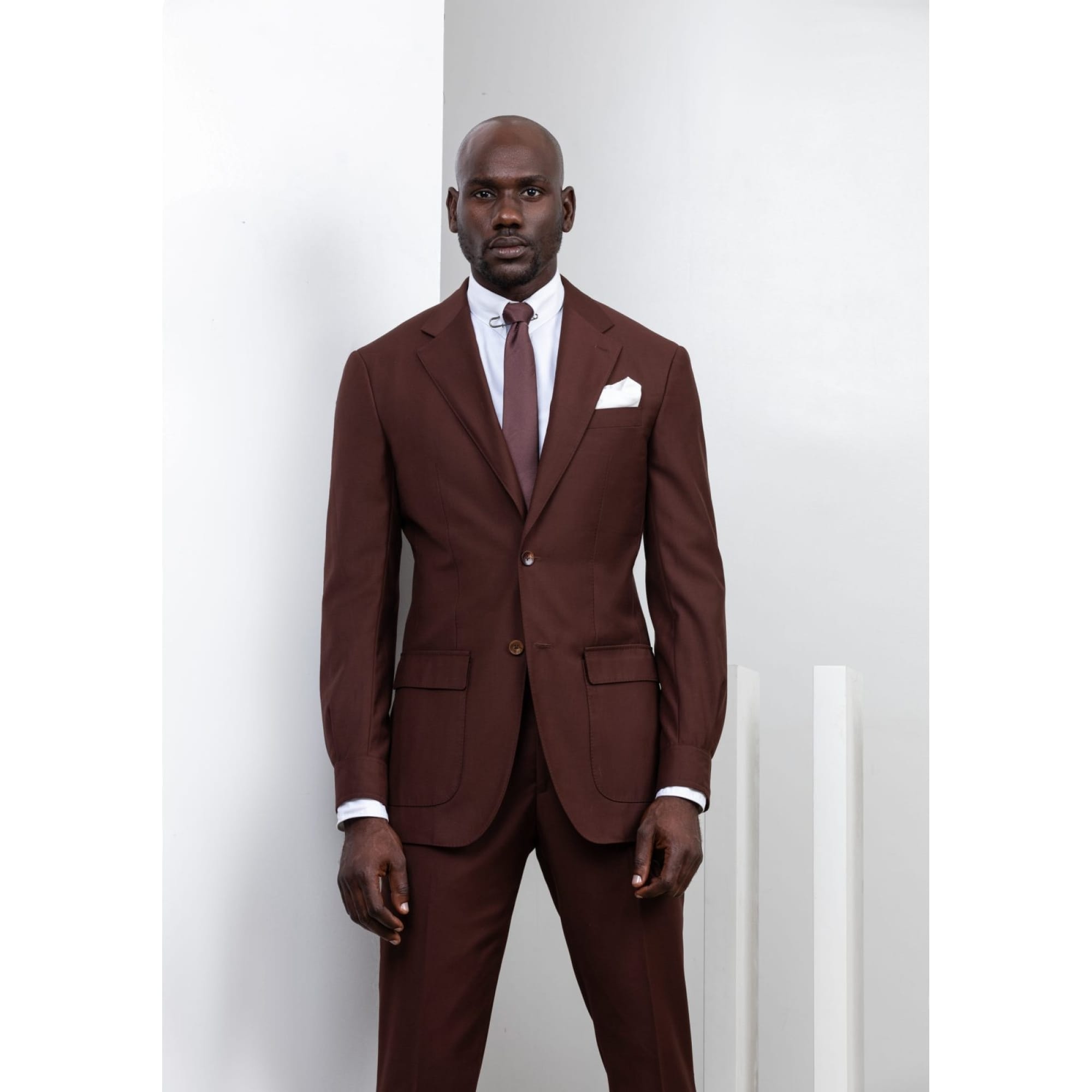 Brown two piece suit with shirt cuff